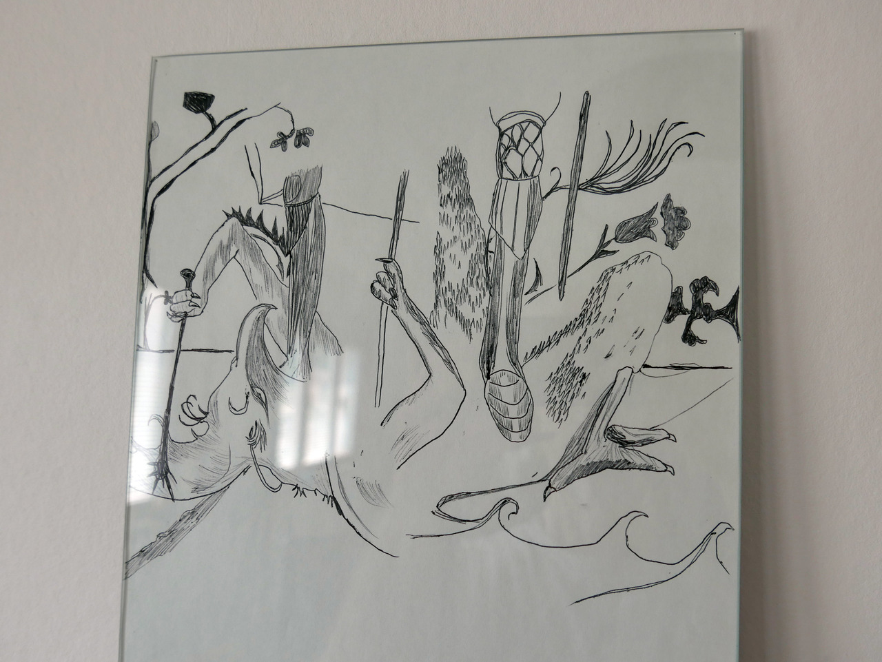 pen ball drawing of a dragon on the ground being killed by a knight